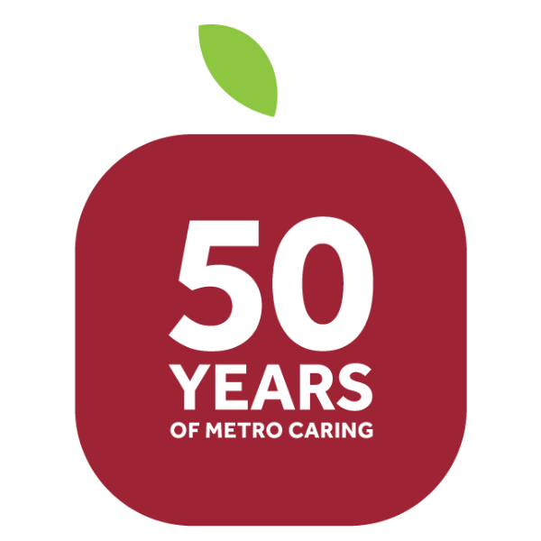 Apple icon with the words "50 Years of Metro Caring" written in the middle.